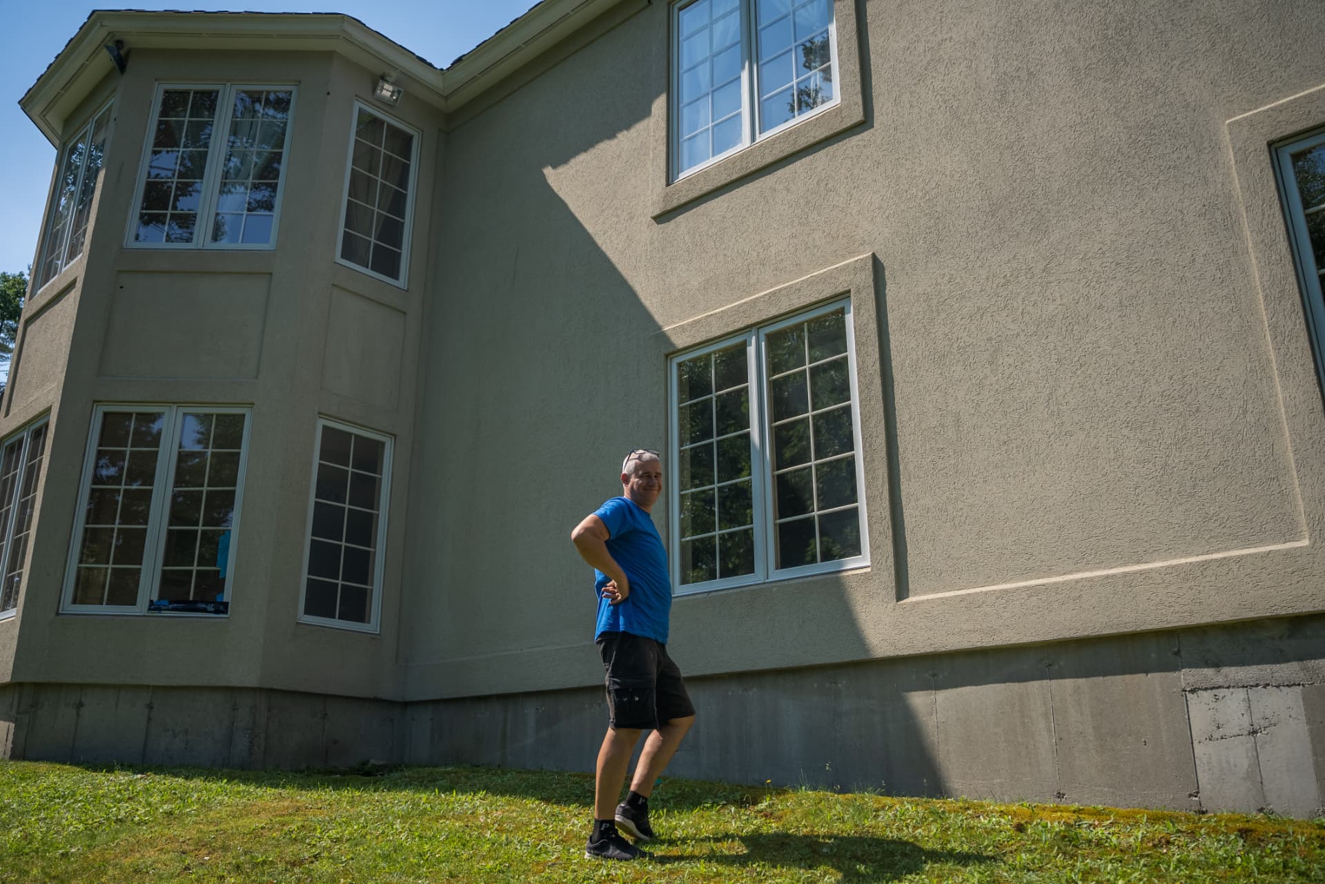 Good Window Works technician inspecting home windows in Massachusetts